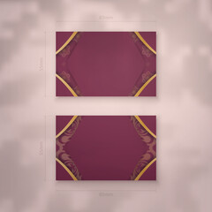 Business card template in burgundy color with vintage gold pattern for your brand.