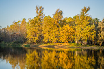 Obraz premium Begec, Serbia - October 30. 2021: Autumn panorama on the artificial lake Begecka jama, near the city of Novi Sad. 