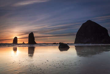 Sunset and reflection of the haystack at Cannon Beach © Yggdrasill