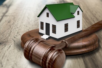 Gavel wooden and house for home buying or selling of bidding or lawyer, real estate and building concept.