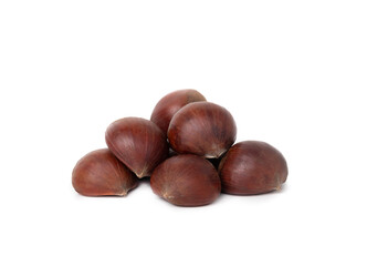 Obraz premium Pile of chestnuts, close up. Perspective view of multiple raw brown sweet chestnut fruits on top of each other. Used in many fall recipes baked, boiled, cooked or pureed. Isolated on white.