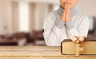 Happy kid girl read bible study. Worship at home.