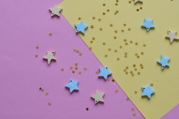NEW YEAR and Christmas Stars background. Different colours. Christmas decoration. Stars.Top view flatlay . background for children's party. Design of Greeting Card With Christmas stars.