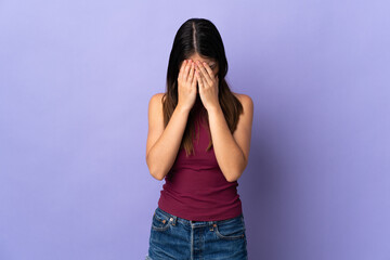 Young caucasian woman isolated on purple background with tired and sick expression