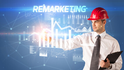 Young businessman with helmet drawing on virutal screen