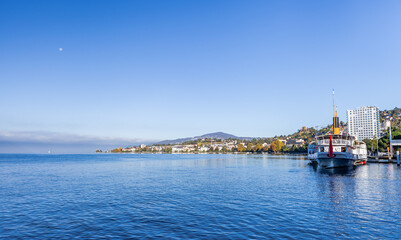 Fototapeta na wymiar MONTREUX, SWITZERLAND - October 24, 2021: The elegant paddle wheel fleet on the lake. Pleasure boat on Lake Geneva, Switzerland.