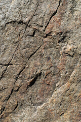 Granite stone texture. Cracked granite rock surface. Natural stone backdrop. Close-up