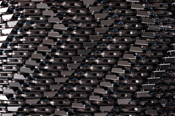 Fototapeta premium Close-up photo shot of grey metal saw chain. Background of sawchains