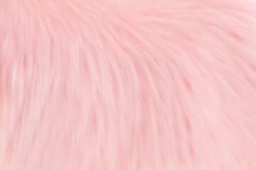 Soft pink blurred texture of faux fur.