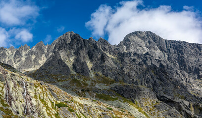 Fototapeta na wymiar Beautiful scenery of the Tatra peaks illuminated by the afternoon sun.