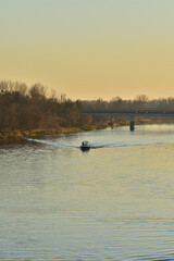 Obraz na płótnie Canvas Speedboat on the river on a sunny autumn day. Summer.
