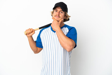 Young blonde man playing baseball isolated on white background thinking