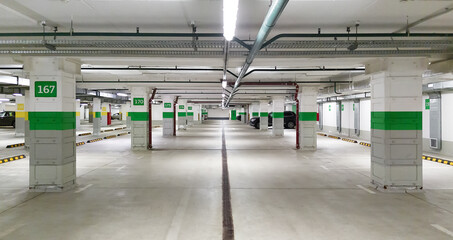 Panorama of empty underground car parking garage