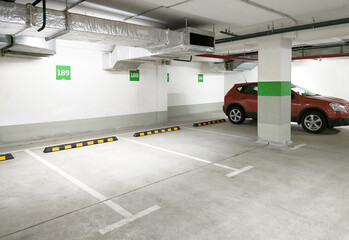 Underground car parking, empty modern parking lot indoor