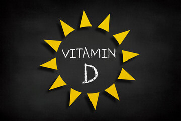 Vitamin D concept, sun icon on blackboard