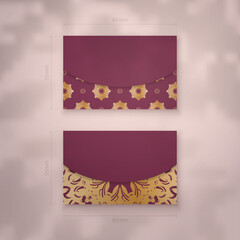 Presentable burgundy business card with vintage gold pattern for your brand.