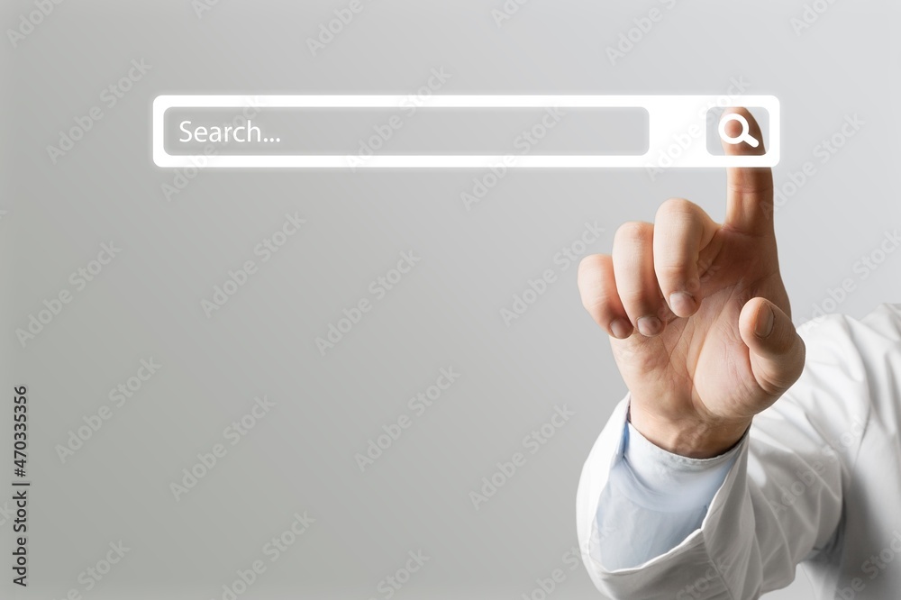 Wall mural A man standing with hands pointing to information search, clicking to virtual internet search page