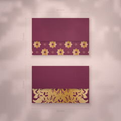 Presentable burgundy business card with vintage gold pattern for your personality.