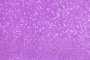 Glitter sparkling purple texture. Beautiful Christmas and new year bokeh blurred background