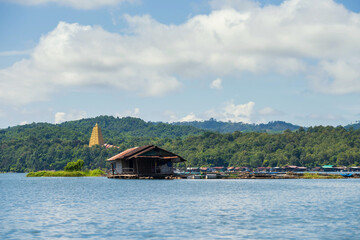 Fototapeta na wymiar Wooden raft villages and Pagoda, Sangkhlaburi