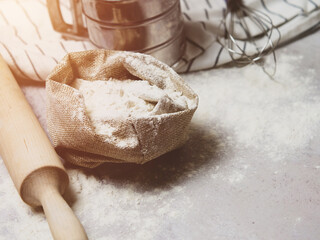 Ingredients for baking: flour, eggs, sugar, close-up on a gray marble background
