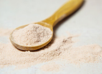 black volcanic indian salt in a wooden spoon