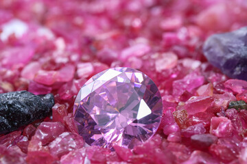 amethyst diamonds on placed on a pile of raw ruby rough gemstone..colorful raw stone background.lived a life of luxury.