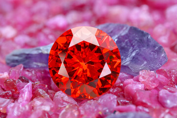 ruby red diamonds on placed on a pile of raw ruby rough gemstone..colorful raw stone...