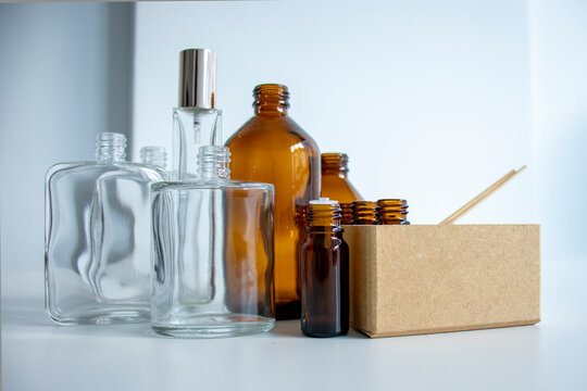 various amber glass bottles for cosmetics, natural medicine , essential oils or other liquids isolated on a white background, top view
