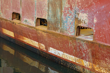 Rusted and beat up hull of one of New Jersey’s fishing fleet boats in Barnegat
