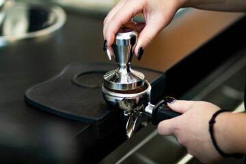 Espresso coffee beans and coffee grinder in a small coffee shop