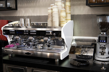 Close up pic of a proffesionnal coffee machine in a coffee shop preparing hot coffee