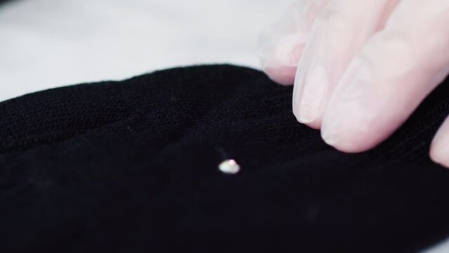 Close up view. Rhinestone gloves with pretty stones into a snowflake pattern.