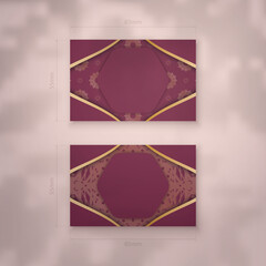 Visiting business card burgundy with Indian gold pattern for your business.