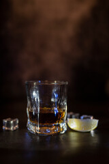 drink alcohol whiskey or rum in a glass glass with ice