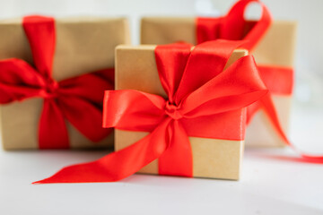 beautiful festive surprise gift box with a red bow on a bokeh background  for new year and valentine's day