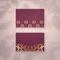 Visiting business card in burgundy color with vintage gold ornaments for your brand.