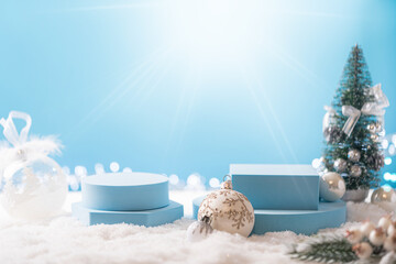 Winter Christmas composition with geometric shapes podiums and christmas decorations on blue background. Empty pedestal for product presentation and for advertising display