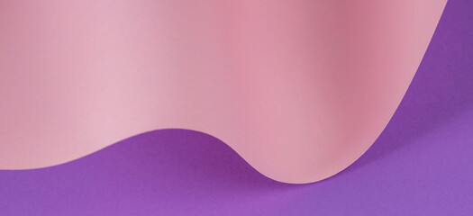 Abstract wave of pastel pink and purple paper. Creative geometric curved paper with light and shadows. Abstract geometry background with copy space