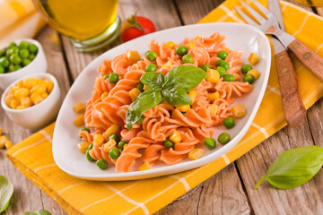 Fusilli pasta with peas and sweet corn.