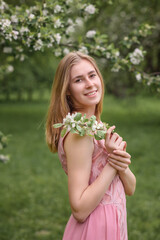 beautiful caucasian girl  in blooming gardens