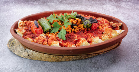 Turkish Beyti Kebap garnished with vegetables on a wooden tray - Turkish, Arabian Food Kebab