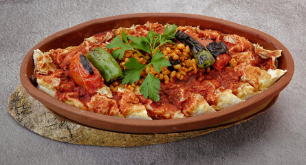 top view of Turkish Beyti Kebap garnished with vegetables on a wooden tray - Turkish, Arabian Food Kebab