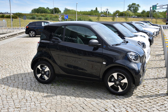 Smart cars, row of German microcars, exposition near Mercedes-Benz Warszawa building. WARSAW, POLAND - AUGUST 2, 2020