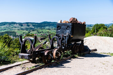 Wagon with bauxite rocks in front of the Farcu mine. Apuseni Mountains, Bihor County, Romania.