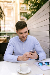 Portrait of a young caucasian businessman in coffeeshop 