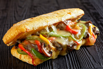 philly steak sandwich with melted cheese, top view