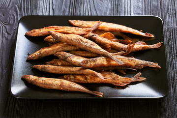 crispy fried capelin, shishamo on a platter