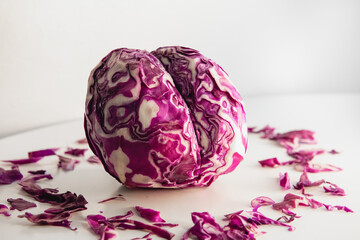 Red cabbage cut in a shape of brain. Concept photo.