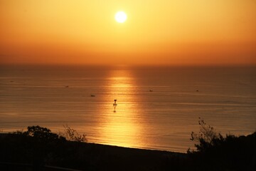 The scene at the moment of sunrise and the silhouette of the family. 
